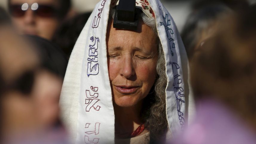 A member of "Women of the Wall" group wears a Jewish prayer shawl and Tefillin a monthly prayer session at the Western Wall in Jerusalem's Old City. May 10, 2013 Credit: Reuters