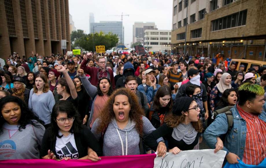 Anti-Trump protesters march along Lavaca Street in Austin, Texas, on Wednesday Nov. 9, 2016. Hundreds of University of Texas students marched through downtown Austin in protest of Donald Trump's presidential victory.(Jay Janner/Austin American-Statesman via AP)